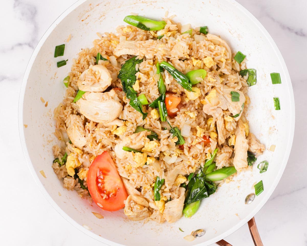 Khao pad — Thai fried rice with prawns and a lime wedge