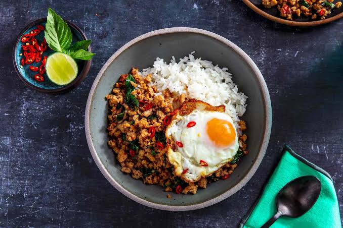 Pad grapow moo — stir-fried minced pork with holy basil over rice and a fried egg