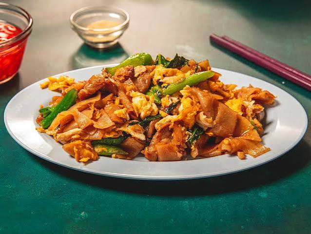 Pad see ew — wide rice noodles with Chinese broccoli and egg