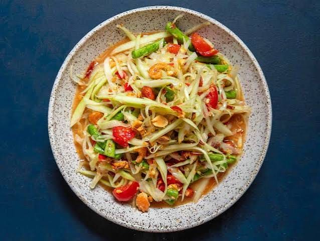 Som tam — green papaya salad pounded with chilli, lime and peanuts