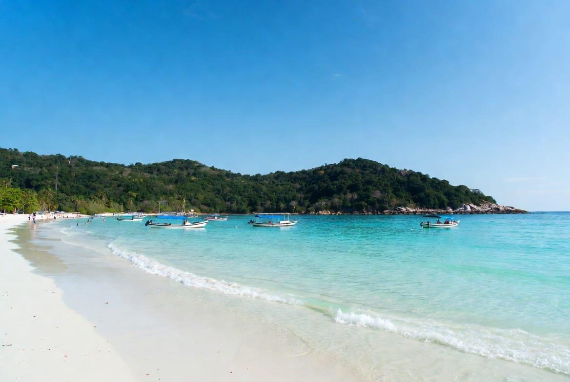 Clear turquoise water and white sand at a Koh Larn beach