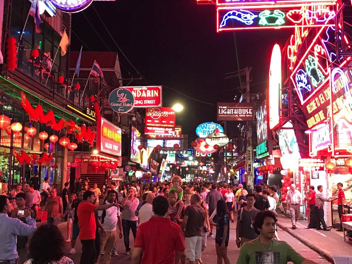 Neon lights and crowds on Walking Street Pattaya at night