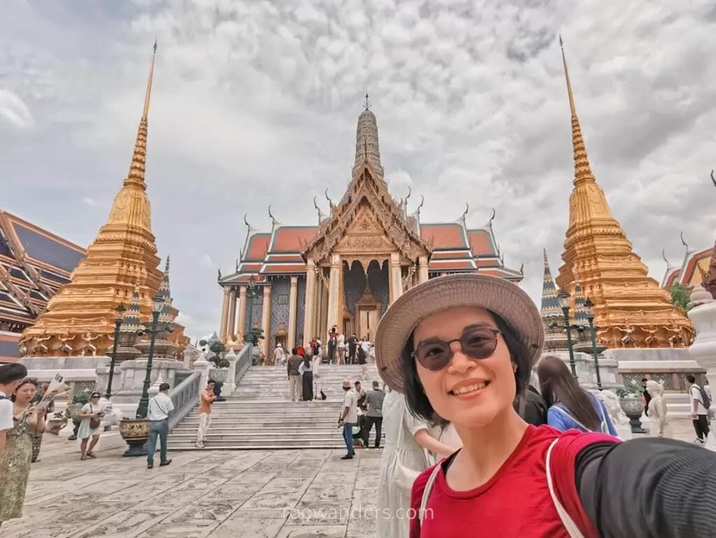 An Indian tourist taking a selfie in front of the Grand Palace in Bangkok